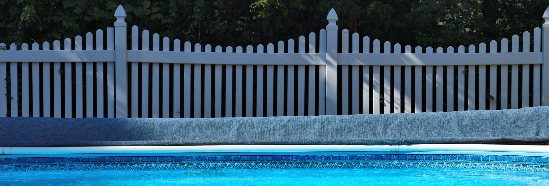 Affordable Vinyl Picket Fence Installed in Florida Backyard with Pool